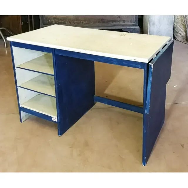 Hardwood desk with open shelves and a small banded top that was raised only when needed. Italy 1970 Measurements cm 122.7...