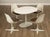 High Quality American Made Vintage Laminate Oval Dining Table and Four Chairs with Vinyl Upholstered Seats, By Burke in...