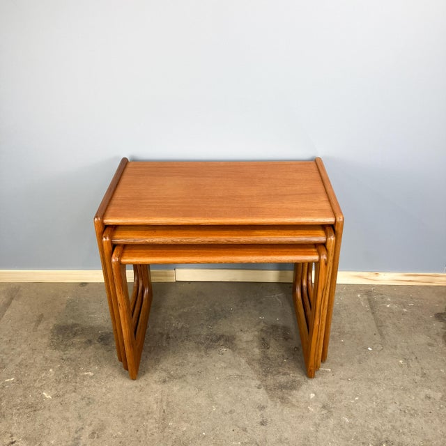 A beautiful set of three tiered side tables, crafted with the typical perfection of Danish mid-century design. The clean...