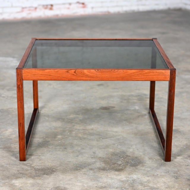 Handsome Mid-20th Century Mid Century Modern coffee or end table with Rosewood square frame & smoked glass inset top....