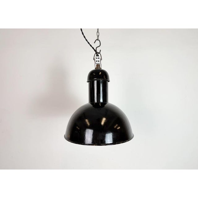 Vintage industrial factory lamp from the 1930s made by aeg in germany black enamel shade with white enamel interior iron...