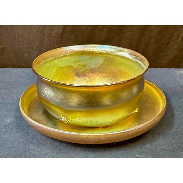 This vintage Tiffany Studios favrile set dates from the early 20th century & consists of a stunning hand blown iridescent...