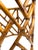 A sculptural rattan table base in the style of McGuire, featuring an intricate geometric lattice construction with tightly...