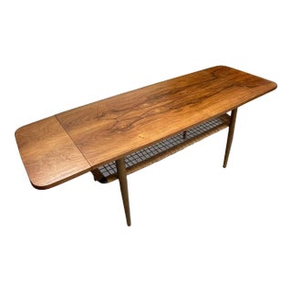 1970s Vintage Danish Modern Coffee Table With Ornate Rosewood Grain and Wicker Shelf For Sale