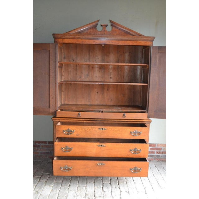 19th-century Dutch oak Empire cabinet. Can be transported in two parts. It is 210 cm high, 133 cm wide, and 51 cm deep....