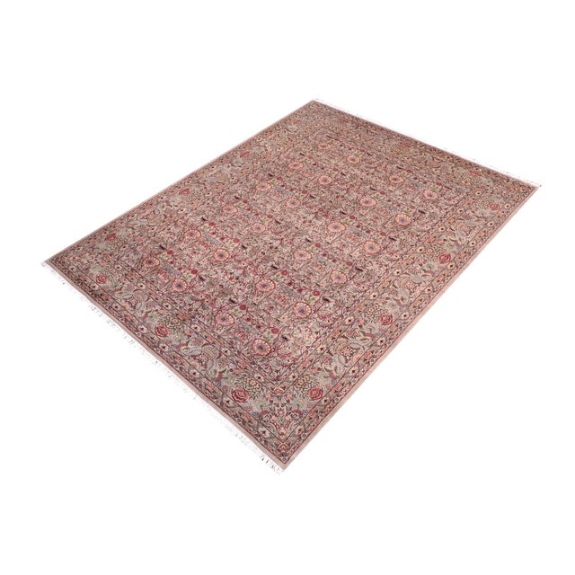 Designed with mesmerizing intricacy and gorgeous color palette, this hand-knotted masterpiece demonstrates the beauty and...