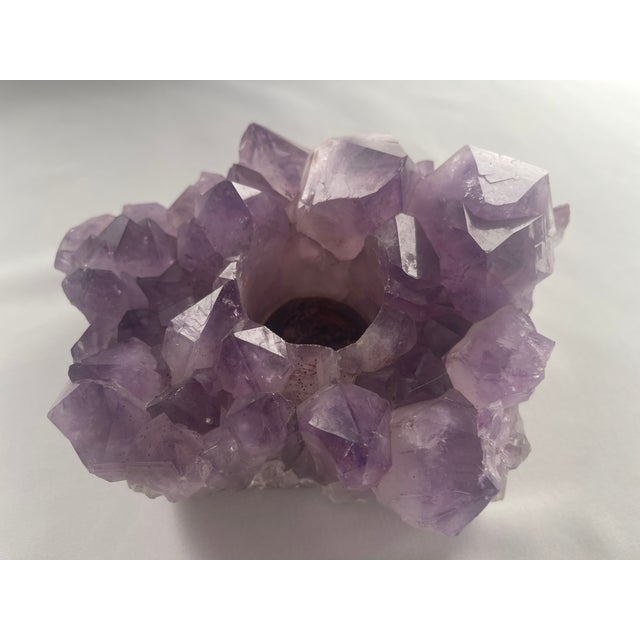 Natural large amethyst crystal cluster votive candle holder has a wonderful illumination and is interesting to look at...