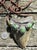 A dramatic statement pendant by Navajo artist Roie Jaque, combining a large fossil megalodon tooth with five substantial...