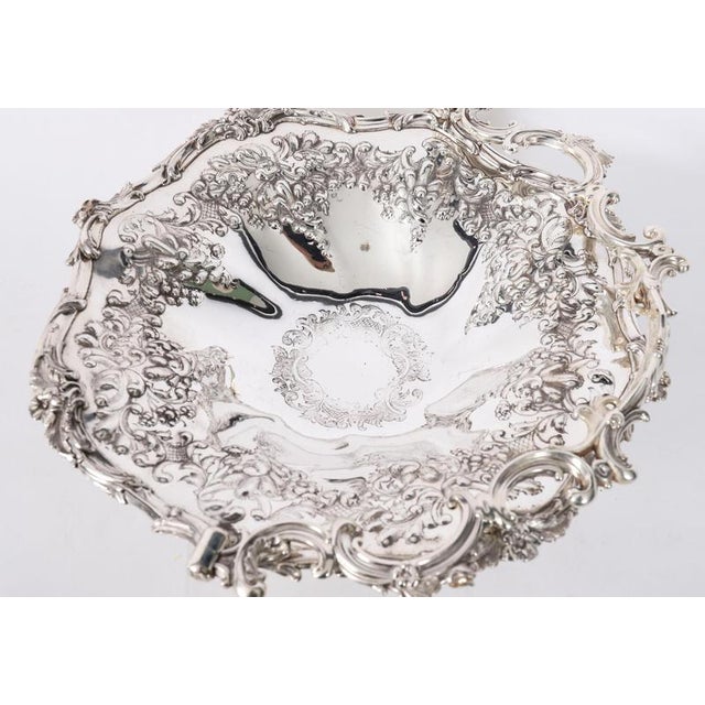 This is a lovely Victorian silver-plated swing handled cake/fruit basket bearing Victoria hallmarks, mid-19th century in...