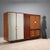 Vintage 20th-century Italian-made wardrobe with hinged doors, drawers, and a mirrored front with a grissinata finish....