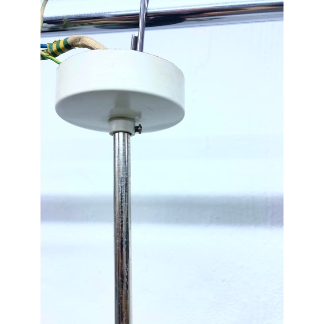 One modern chandelier from the 1960s/70s, 12 lights, E14 sockets, by Kaiserleuchten. White glass, cream-white painted...