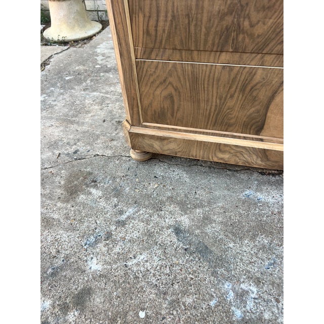 Elegant French 19th-century Louis Philippe commode crafted in richly figured burl walnut, featuring four drawers with...