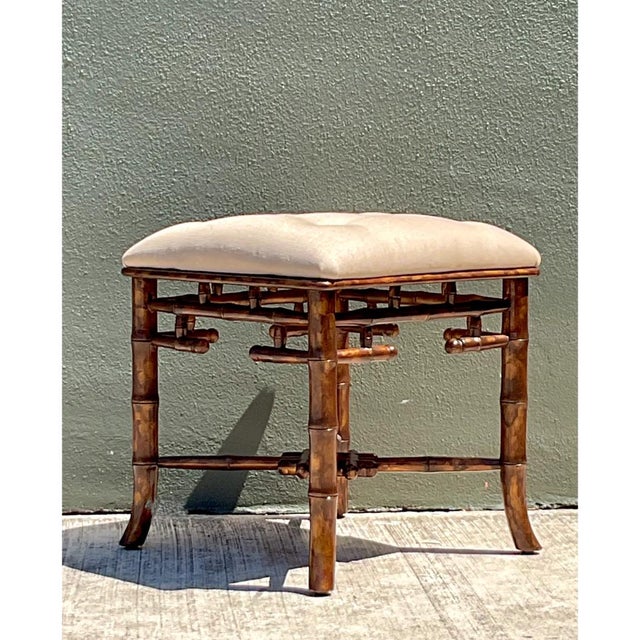 Crafted in carved hardwood with a rich tortoise-stained finish, this mid-century low stool features an intricate faux...
