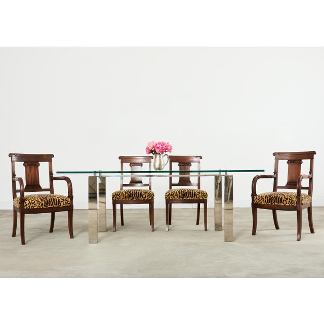 Handsome set of six English Anglo-Indian hand-carved hardwood dining chairs. The set consists of 2 side chairs measuring...