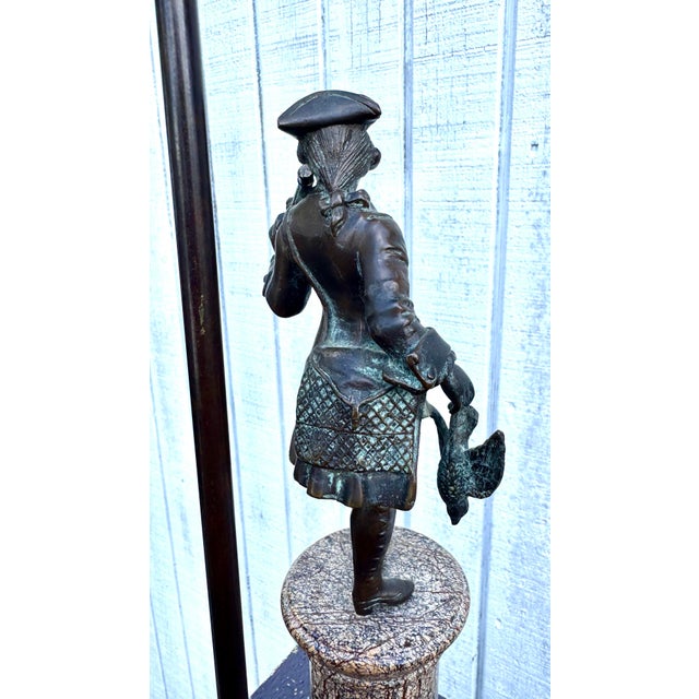 Exquisitely cast in bronze with a marble base, this lamp evokes the elegance and craftsmanship of early American history....