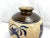 A vintage Asian-style earthenware pottery jar with fish motif. Excellent to group with other like items as porch, deck or...
