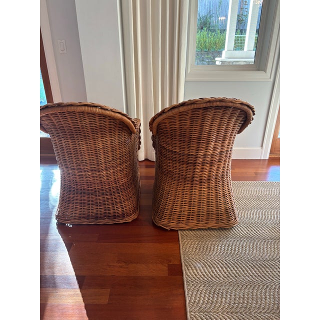 Both chairs have built in upholstery with a removable plush seat cushion for added comfort. The rattan is in great...