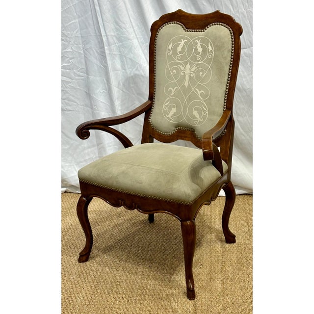 A stylish, hand crafted arm chair by Minton-Spidell Inc. Features, Custom Designed Suede by Pasini Design and Brass Nail...