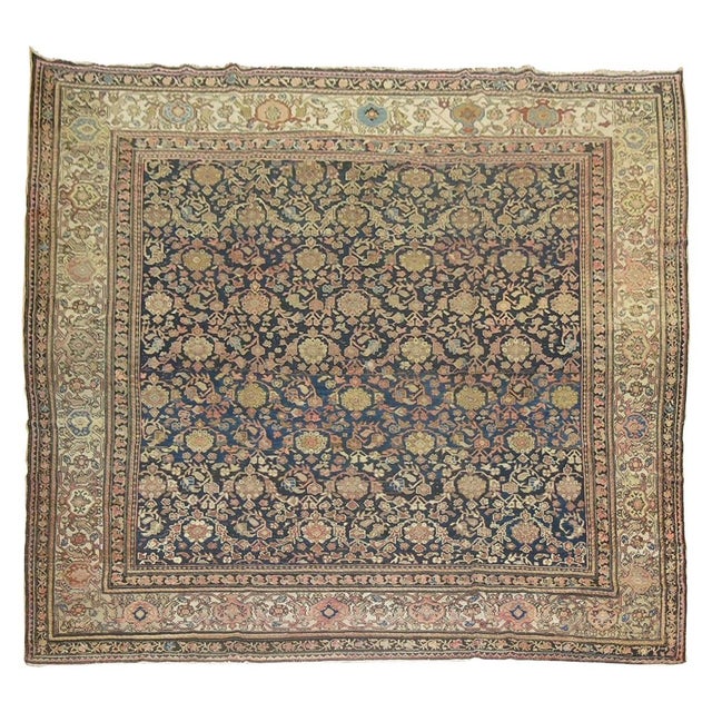 A rare size Persian Malayer rug with predominant accents in beige and dusty rose on an Abrash blue field, circa 1920,...