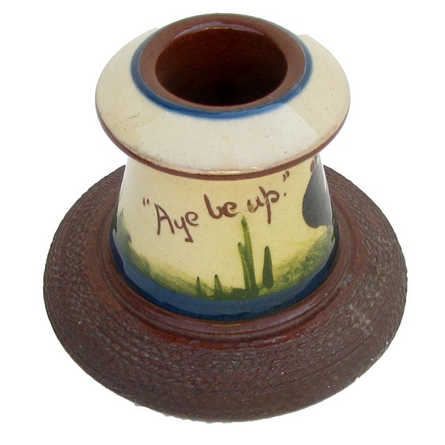 This charming match strike / vesta is lovely example of English Torquay red earthenware pottery. Decorated in an early...