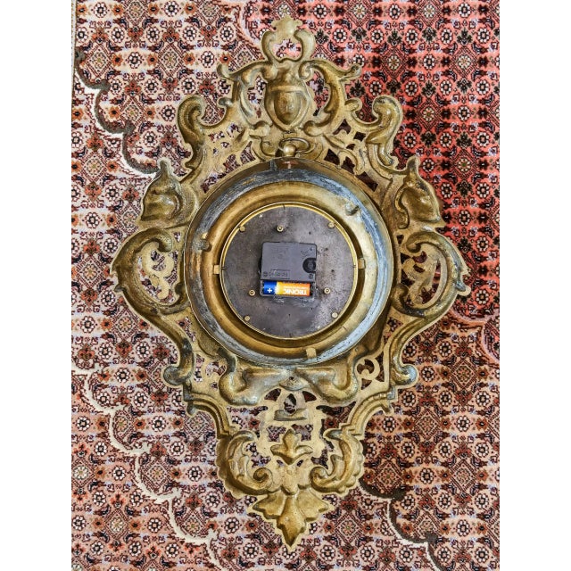 The impressive wall clock in a richly decorated baroque frame represents an exceptional decorative object with a touch of...