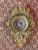 The impressive wall clock in a richly decorated baroque frame represents an exceptional decorative object with a touch of...