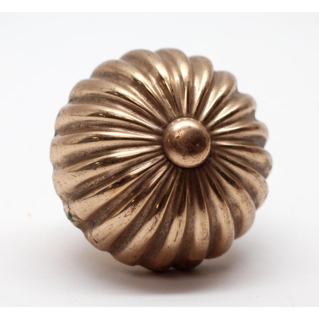 Fluted shaped polished brass knob. The manufacturer and date of creation is unknown. Takes an entry size (0.375 in....