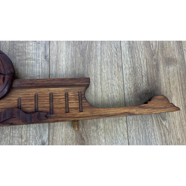 A beautifully carved antique French pediment featuring elegant scrollwork and decorative ribbon detailing. Crafted from...