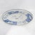 This stunning vintage oval tole tray features a classic blue and white aesthetic with an intricate hand-painted...