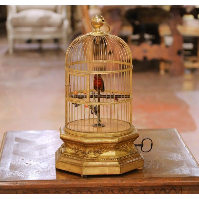 This exceptional antique singing bird automaton clock, crafted in France circa 1880, is a finely executed example of...