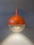 stunning IKEA Väster pendant light in a vibrant orange finish, featuring a playful, aquarium-inspired design that creates...