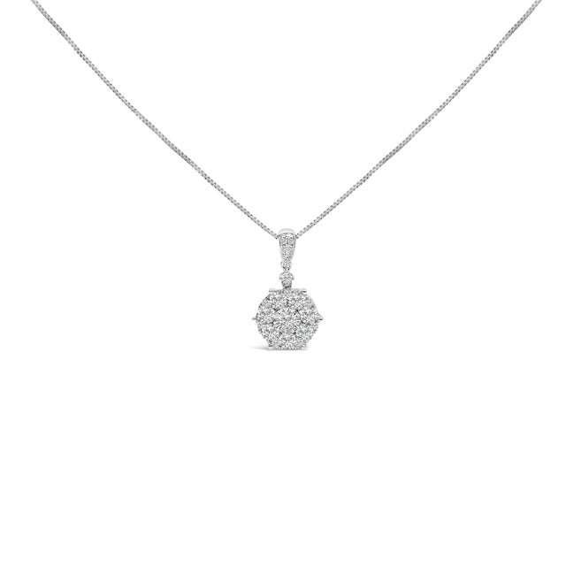 Discover the radiant elegance of this 14K white gold pendant necklace, where a cluster of natural diamonds dazzles...