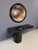 A monumental and highly sculptural postmodern console table with matching round mirror by acclaimed American designer J....