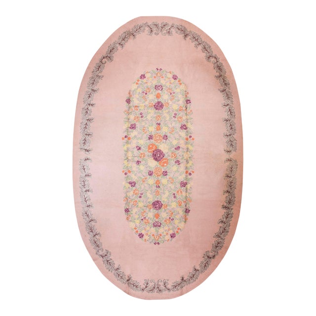 Refined Pink-Blush Open Field With Decorous Center Floral Pattern Vintage American Hooked Rug For Sale