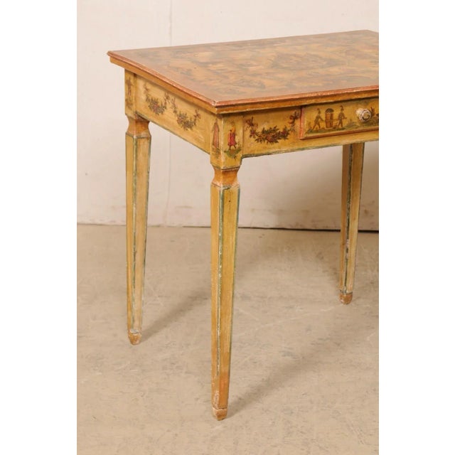An Italian occasional table with its original "lacca povera" finish from the 18th century. This finish is also known as...