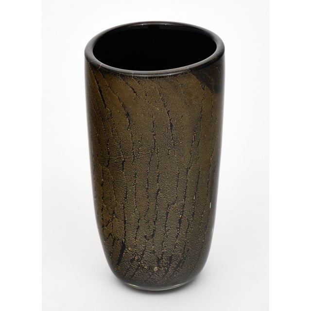Black and Avventurina Murano glass vase with 23 carat gold leaf applied to the black glass while still in fusion. We love...