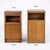 A characterful pair of mid century bedside cabinets in warm-toned wood, offering a subtly mismatched look that adds charm...