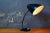 This lamp from the 50s has a striking look: a black, tapered sheet metal lampshade like a racing car, with generous...