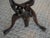 Description A finely carved mid‑20th‑century hardwood serpent tripod stand, crafted from a single block of wood and...