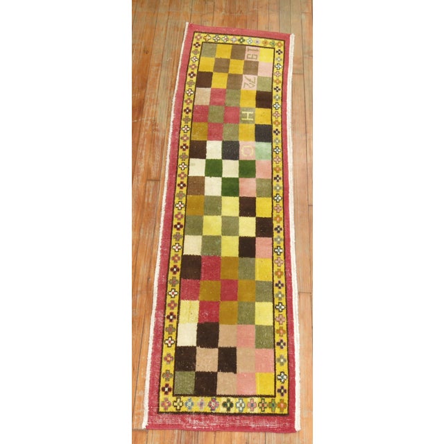 Funky narrow vintage Turkish runner, dated 1972. Pinks, yellow, brown, goldenrod, pea green accents Measures: 1'9'' x 7'.