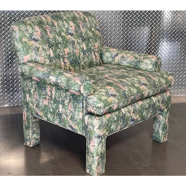 A single vintage parsons style arm chairs. Throwback 80s/90s style vintage. The upholstery reminds of Monet. The...