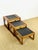 An elegant set of three nesting tables in solid teak with black glazed ceramic tiles, typical of 1960s scandinavian...