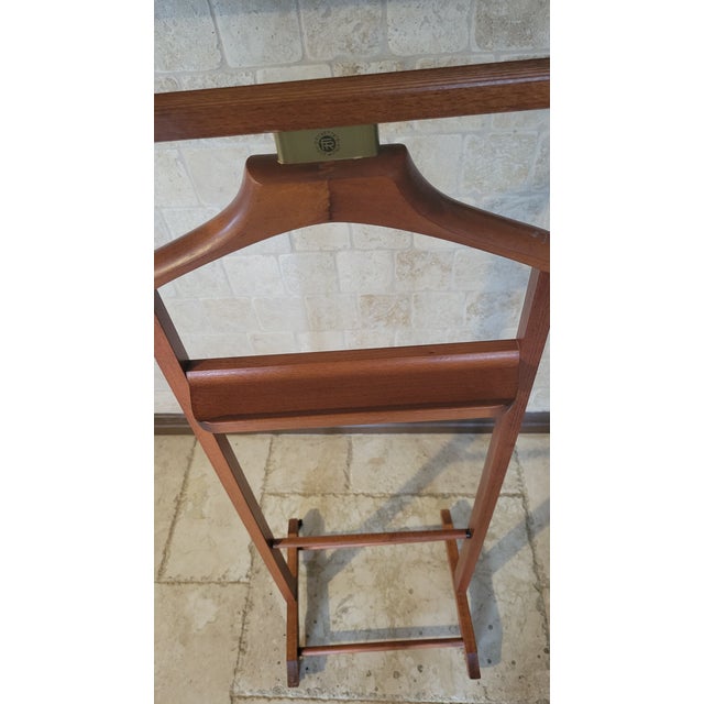 Refined yet practical, this classic wooden valet stand offers a timeless solution for organizing daily wear with...