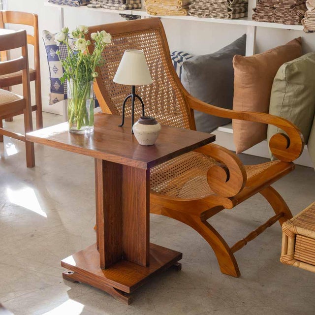 Lovely wood side table from France, 1940s. Rectangular top rests on a pedestal base. Original finish shows nice natural...