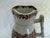 An Ironstone pitcher made by Cork, Edge, Malkin & Co.in a transfer ware pattern with geometric borders. It is the Thistle...