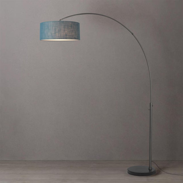 The Float Arc Lamp is a Modern arc lamp designed by Peter Morelli in 1960. It features a sleek black nickel steel body and...