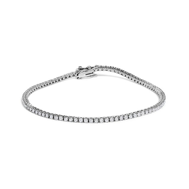 Indulge in the elegance of timeless beauty with this 14K white gold tennis bracelet. Radiating grace with every movement,...