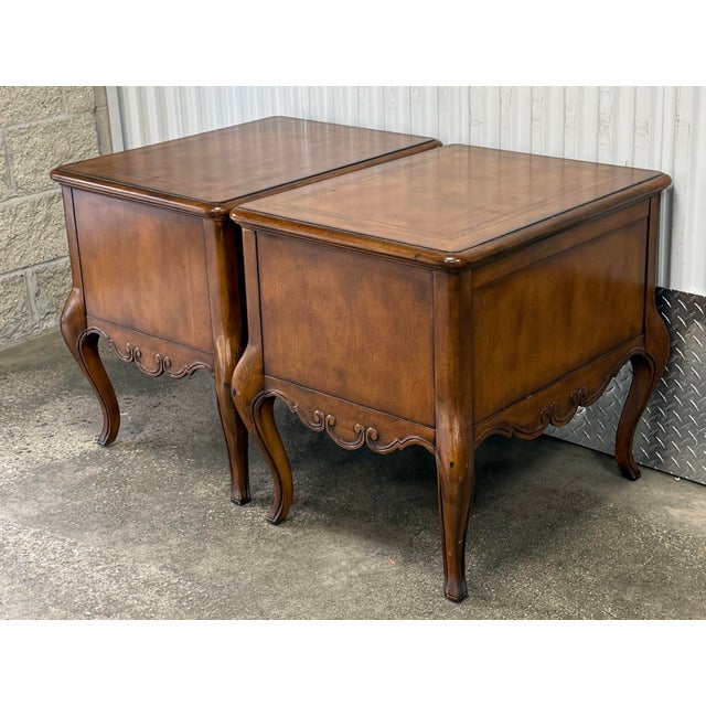 Generously proportioned end tables by Thomasville. Features elegant cabriole legs , banded top, scallop carved bottom...