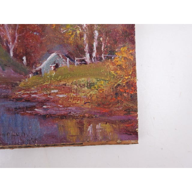 Vintage early 20th century oil on canvas board landscape painting with riverside cabin. Signed illegibly bottom center....