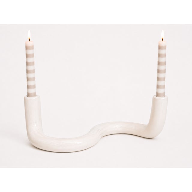 Sculptural white glazed ceramic double taper candle holder featuring an elegant serpentine wave form. A striking Organic...